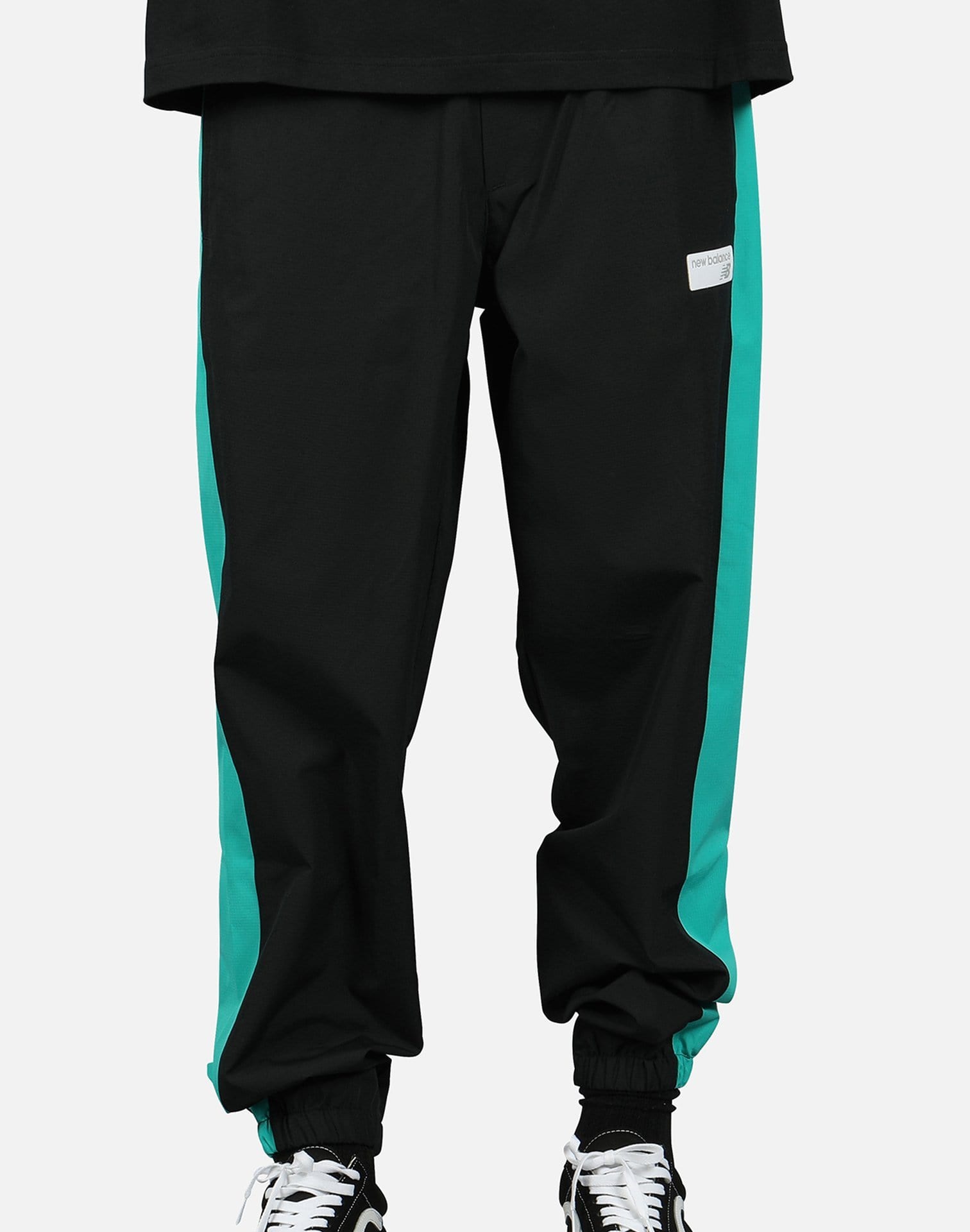 New Balance NB ATHLETICS WINDBREAKER PANTS New Balance NB ATHLETICS WINDBREAKER PANTS